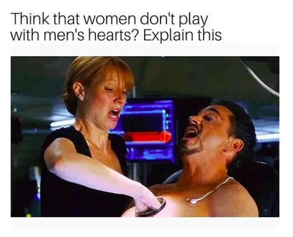 woman playing with man heart meme